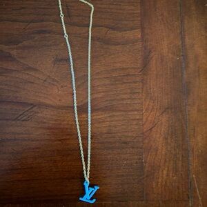 Gold tone Necklace with Blue Pendant